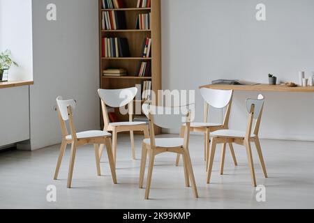 Horizontal image of empty room for psychotherapy session with chairs standing around Stock Photo