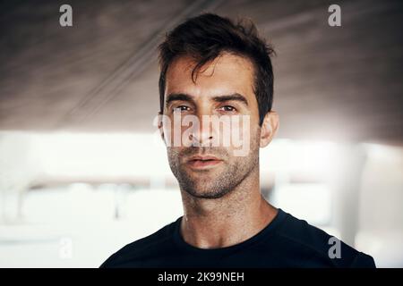 Instead of making excuses, make something incredible happen. Portrait of a sporty young man exercising outdoors. Stock Photo