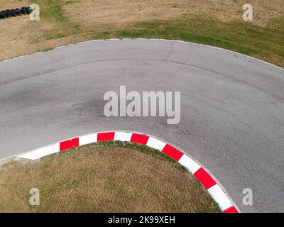 Curves on karting race track, aerial view background. Stock Photo