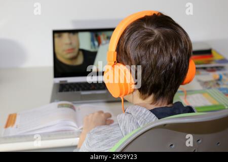 Symbol image: Elementary school student doing digital homeschooling (model released) Stock Photo
