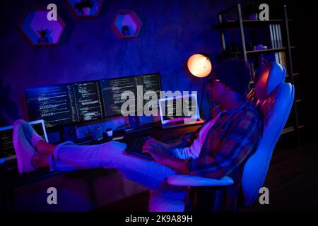 Full size profile photo of professional trader sit chair keyboard typing debugging late office indoors Stock Photo