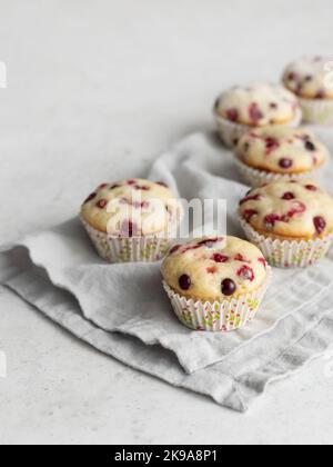 Cranberry muffins on linen napkin with text space Stock Photo