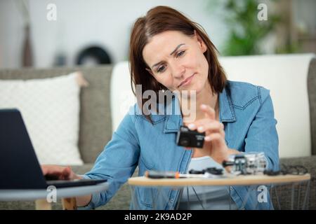woman trying to figure out to use her new camera Stock Photo
