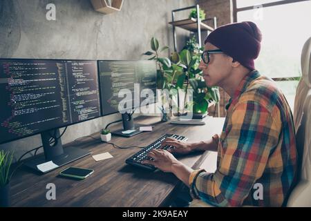 Profile portrait of intelligent guy sit chair keyboard typing debugging improving workplace indoors Stock Photo