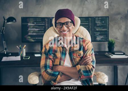 Portrait of positive professional hacker sitting chair crossed hands server optimization workplace indoors Stock Photo