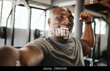 Strong black woman flexing arms, muscle and body power, fitness and  wellness in urban Jamaica outdoors. Portrait proud female athlete energy,  exercise and happiness of healthy bodybuilder lifestyle Stock Photo