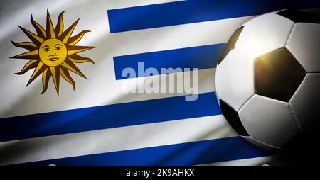 Uruguay national team composition with classic ball on grass and flag in the background. Top view. Stock Photo