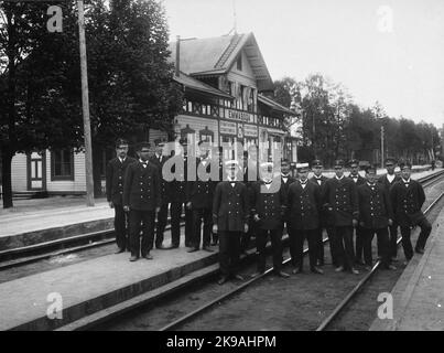 Station inspector H V Bergdahl with staff at Emmaboda Railway Station. Stock Photo