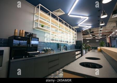 Empty kitchen area in coworking space, creative zoning in office center Stock Photo