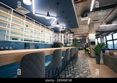 Creative zoning in a modern coworking space, stylish bar area Stock Photo