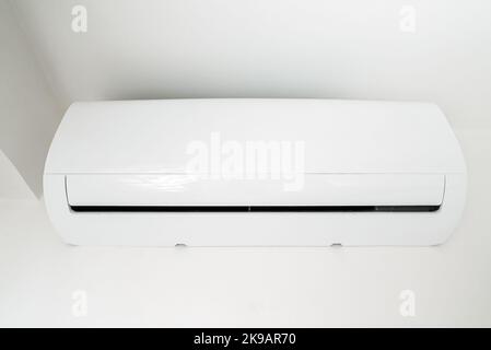 Air conditioner inverter mounted on the wall. Stock Photo