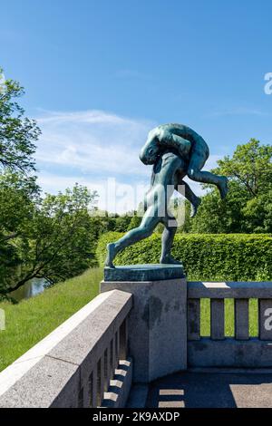 Two bronze sculptures,men, created by Gustav Vigeland, the Bridge, Vigelandsanlegget.Vigeland Sculpture Park installation, Frogner Park, Oslo Stock Photo