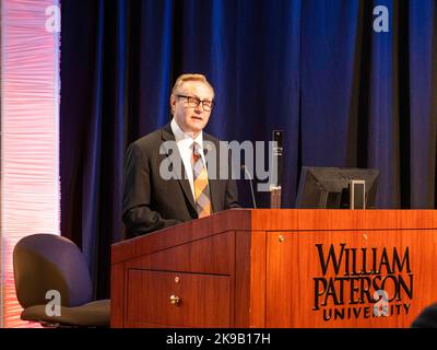 (221027) -- WAYNE, Oct. 27, 2022 (Xinhua) -- William Paterson University (WP) President Richard J. Helldobler delivers remarks during an international symposium 'Across Time and Space: The Silk Road and the Silk City' at WP in Wayne, New Jersey, the United States, on Oct. 26, 2022. Known as U.S. 'Silk City,' Paterson, in the northeastern U.S. state of New Jersey, was considered to be the final stop for China's historic Silk Road that connected civilizations of different parts of the ancient world. This is one of the themes of an international symposium that opened Wednesday morning online and Stock Photo