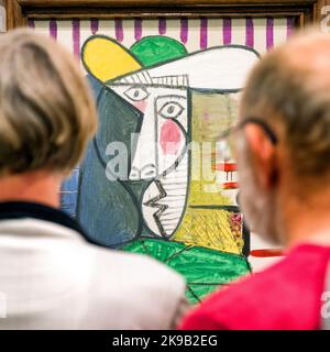 LONDON, UNITED KINGDOM - MAY 12, 2018: Visitors looking at Pablo Picasso painting Bust of woman at Tate modern in London Stock Photo