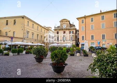 An empty Freedom Square (Piazza della Liberta) in old town Spoleto at dawn before opening hours. Umbria, Italy. Stock Photo