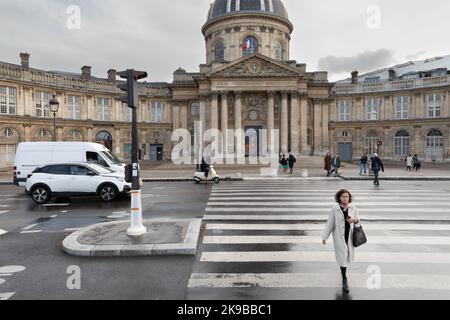 Crossing the street - Paris France Stock Photo