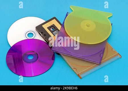 Retro music records audio cassette and compact discs pile Stock Photo