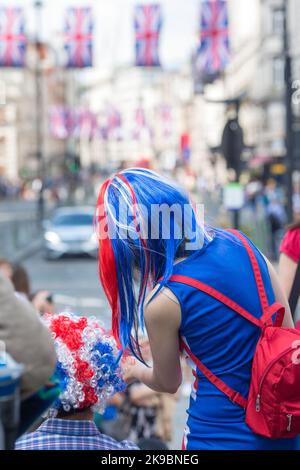 Revellers in Union Jack-themed costumes gather in Piccadilly Circus, central London, on the first day of the Platinum Jubilee weekend. Stock Photo