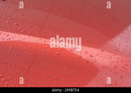 Drops on car. Surface of machine. Rain on transport. Texture of hood. Stock Photo