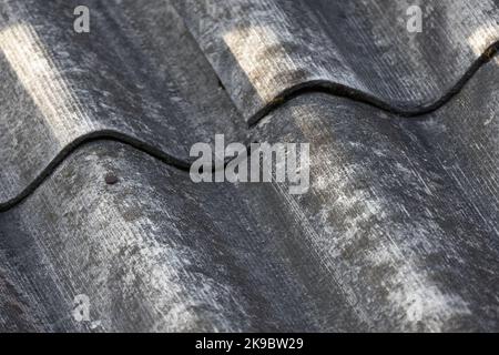 Grungy gray weathered slate roof, background photo texture Stock Photo