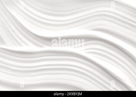White foam texture close up background. Soapy substance with bubbles backdrop. Creamy grainy macro. Shower gel, washing liquid smears wallpaper. Cosme Stock Photo
