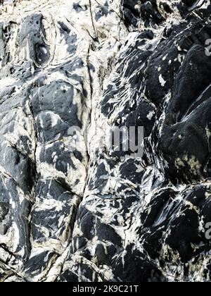 Full frame texture background of hard granite rock with calcium deposits creating marble effect with copy space Stock Photo