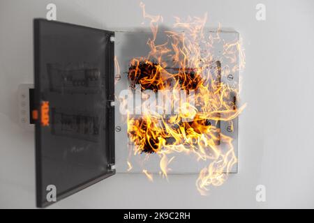 the electrical panel is on fire Stock Photo