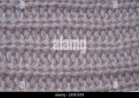 Handmade knit material with detail woven threads. Stock Photo