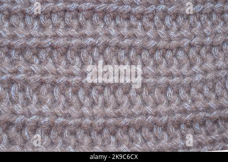 Handmade knit material with detail woven threads. Stock Photo