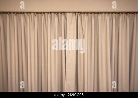 Closed brown velvet curtain wavy background Stock Photo