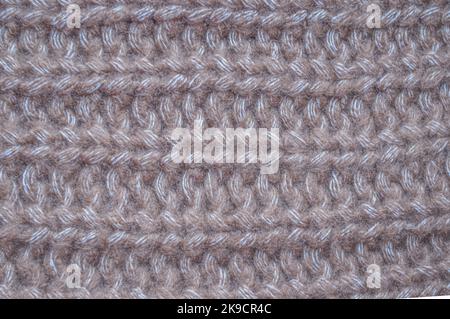 Handmade knit material with detail woven threads. Stock Photo
