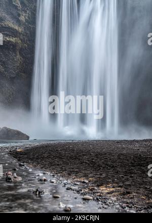 The foot of Skogafoss waterfall in iceland, taken with a long exposure. Stock Photo