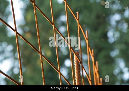 Rusty metal wire mesh of the fence. Wire Mesh Grid Texture. Stock Photo