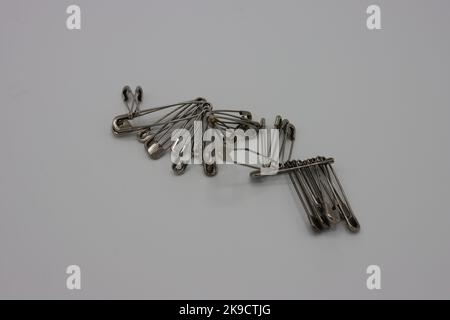 Sewing accessories on a white background. Safety pins Stock Photo