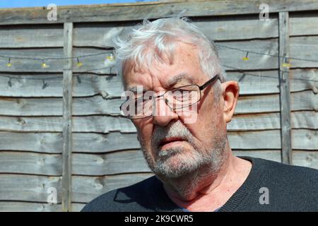 Thoughtful elderly man looking puzzled or worried. Stock Photo
