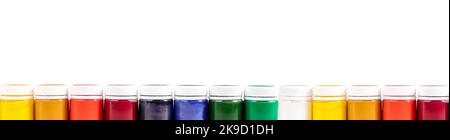 Gouache paints jars of different color, multicolor border of dyes in bottles isolated on white background. Banner with copy space for text. High quality photo Stock Photo