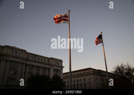 Washington, USA. 27th Oct, 2022. A general view of the District of Columbia flag and the American flag flying at dawn, in Freedom Plaza, in Washington, DC, on Thursday, October 27, 2022. (Graeme Sloan/Sipa USA) Credit: Sipa USA/Alamy Live News Stock Photo