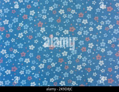 Close up on a high detailed photograph of a Japanese furoshiki cloth made in cotton fabric with a pattern design illustrated with japanese sakura cher Stock Photo