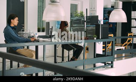 Software developer typing programming code on computer keyboard, innovating online cloud computing. Casual programer sitting at desk developing html script on terminal window server. Stock Photo