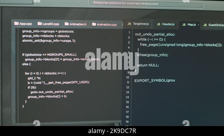 Monitor of software developer typing programming language and html script text of web app. Computer displaying system source code and program developing, cyber security. Close up. Stock Photo