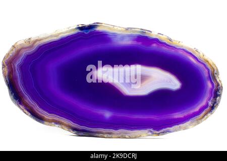 Purple and Blue agate slice crystal , banded chalcedony stone isolated on a white background surface with lots of detail. Copy space Stock Photo