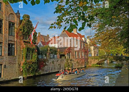 Bruges (Brugge) in Flanders, Belgium and autumnal colours show on trees lining the Groenerei Canal. Stock Photo