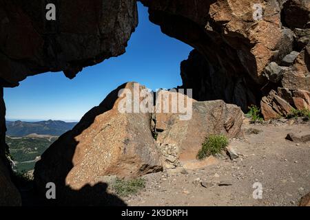 WA22563-00...WASHINGTON - View through keyhole where the Boundary Trail crosses through a rock ridge in Mount St. Helens National Volcanic Monument. Stock Photo