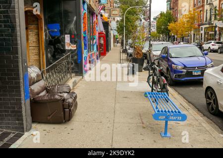 Sidewalk scene, 1400 North block of Milwaukee Avenue, Wicker Park neigborhood, Chicago, Illinois. Stock Photo