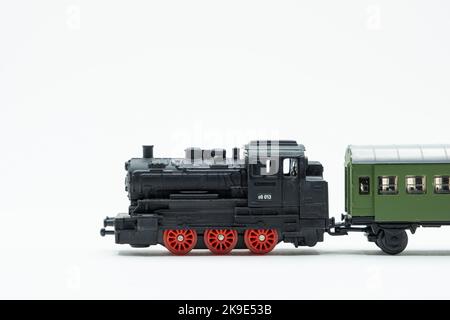 Black locomotive with reed wheels. Vintage train toy Stock Photo
