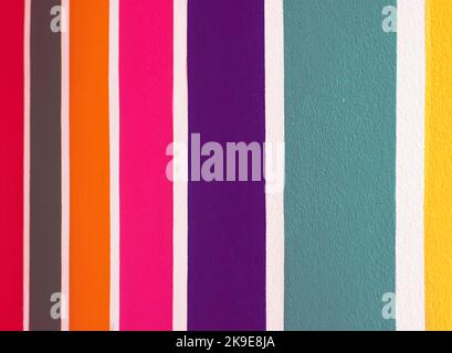 Multicolor vertical striped pattern on cement wall. Colorful painted on cement surface of the wall. Graffiti in the colors of rainbow. Colour full of Stock Photo