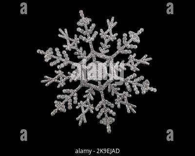 Shiny silver snowflake on black isolated background. Christmas, new year. Copy space Stock Photo