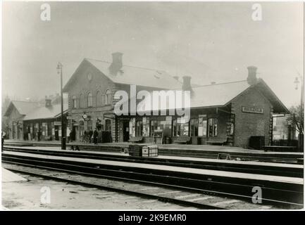 Two -storey station house in stone, built in 1863. Extended in 1876 and 1890. New station house in brick 1919, inaugurated in 1921,1914, was erected, as a provisional during the rebuilding period, a station building south of the present. It remains in 1991 and is used by the post office. At the southern entrance, SJ's plant depot was located. An older locomotive was replaced by a sevenports with a turntable Stock Photo