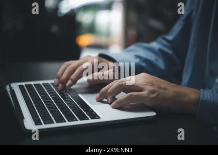 businessman working by typing on the laptop keyboard at the office.Business internet digital technology online. Stock Photo