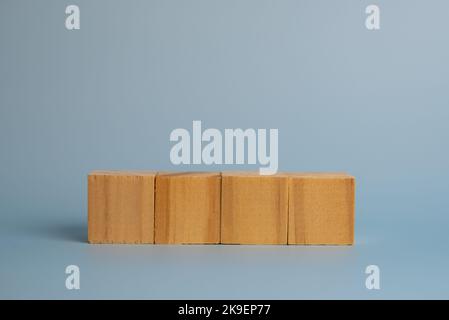 Four blank wooden block cubes on background for your text. Business concept template and banner. Stock Photo